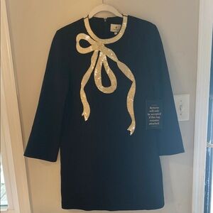 Elegant Black Dress with Gold Sequin Bow